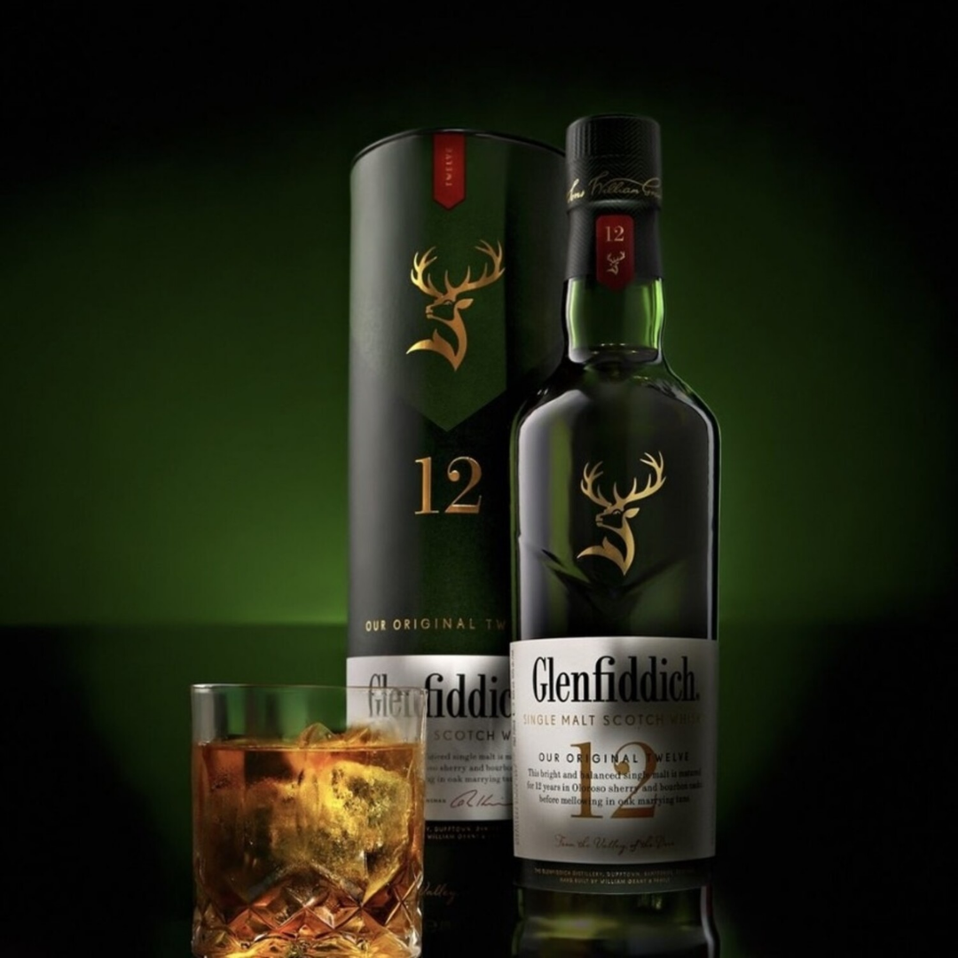 Glenfiddich 12 Years single malt Scotch whisky bottle with packaging and whisky glass, showcasing smooth Speyside character