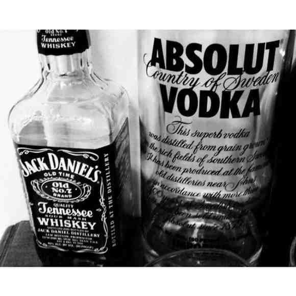 Authentic Jack Daniel’s whiskey bottle and Absolut vodka bottle side by side in Kathmandu liquor market context