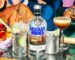 Absolut Vodka bottle with fresh cocktail ingredients on a bar table